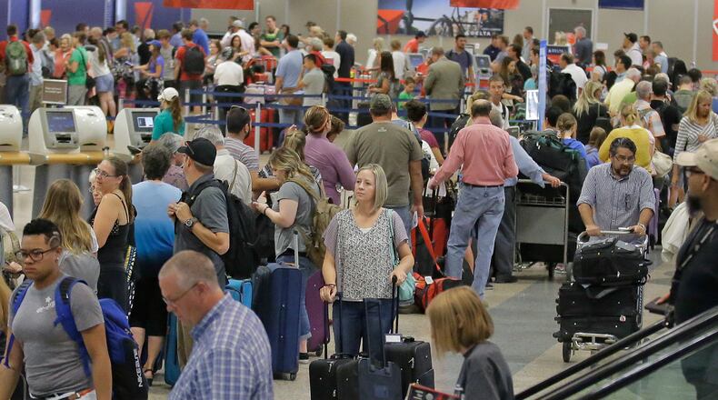 Delta passengers stand in line as the carrier slogged through day two of its recovery from a global computer outage Tuesday, Aug. 9, 2016, in Salt Lake City. Travelers on Delta Air Lines endured hundreds more canceled and delayed flights on Tuesday as the carrier slogged through day two of its recovery from a global computer outage. By early afternoon, Delta said it had canceled about 530 flights as it moved planes and crews to “reset†its operation. Nearly 1,200 Delta flights had been delayed, according to tracking service FlightStats Inc. (AP Photo/Rick Bowmer)