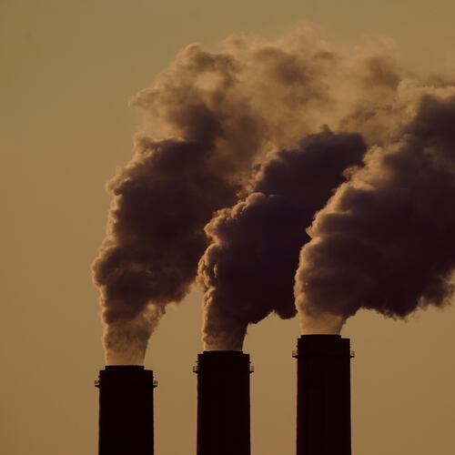 FILE - Emissions rise from the smokestacks at the Jeffrey Energy Center coal power plant as the suns sets, near Emmett, Kansas, Sept. 18, 2021. (AP Photo/Charlie Riedel, File)