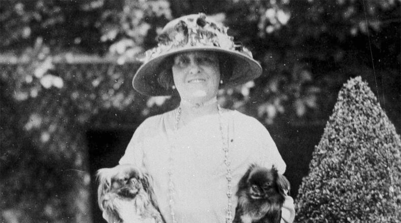 FILE - American author Edith Wharton poses with her dogs in France, 1923. (AP Photo, File)