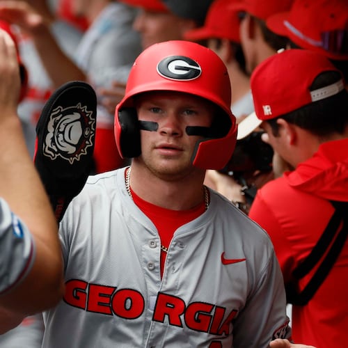 Georgia Bulldogs catcher Daniel Jackson (3) high fives teammates after scoring during the first inning of their Game 2 of the NCAA Super Regional at Foley Field on Sunday, June 7, 2026, in Athens. Miguel Martinez/AJC)