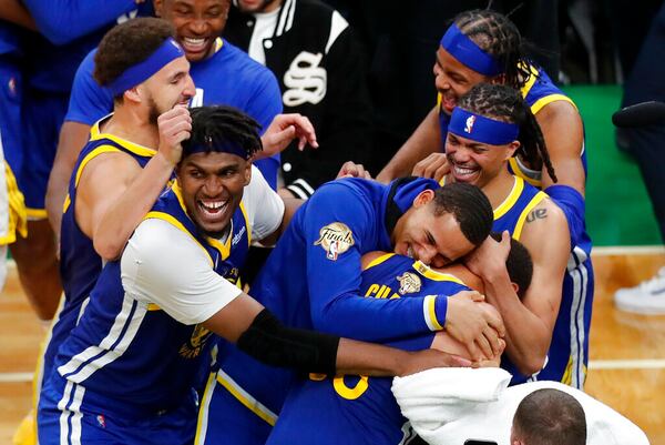 The Golden State Warriors celebrate after beating the Boston Celtics in Game 6 to win basketball's NBA Finals championship, Thursday, June 16, 2022, in Boston. (AP Photo/Michael Dwyer)