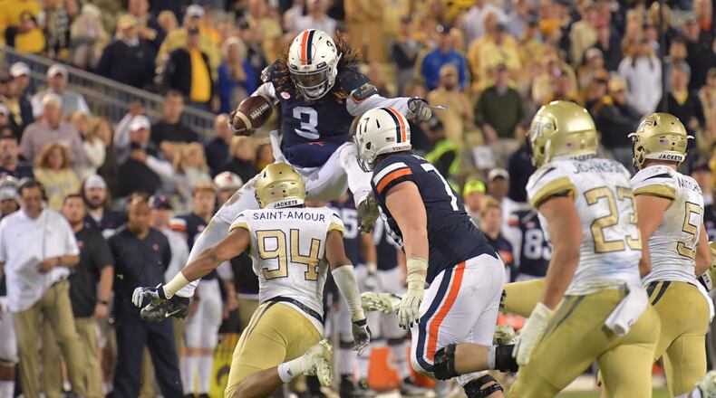 November 17, 2018 Atlanta - Virginia quarterback Bryce Perkins (3) tries to break through against the Georgia Tech in overtime at Bobby Dodd Stadium on Saturday, November 17, 20. Georgia Tech won 30-27 over the Virginia in overtime. HYOSUB SHIN / HSHIN@AJC.COM