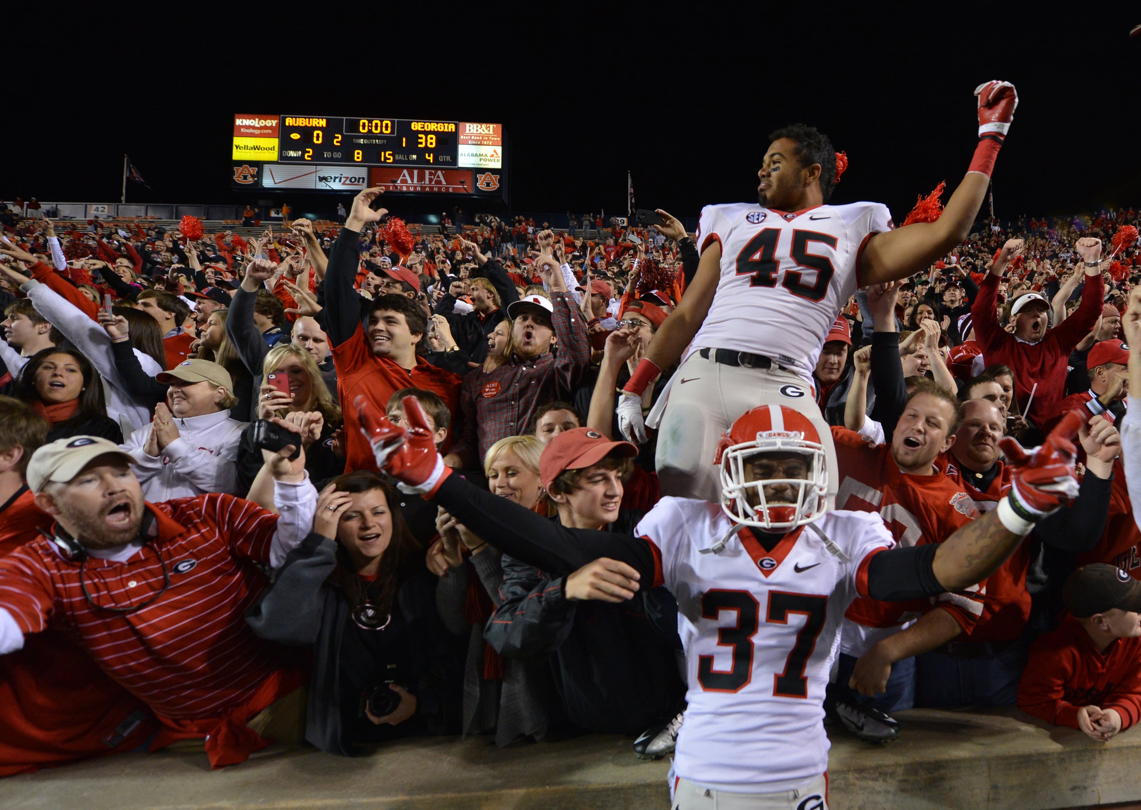 University of Georgia linebacker Christian Robinson (in crowd) — pictured celebrating a UGA win in 2012 — brought the team's entire defensive line to Weaver D's when he was a student. "(It) is one of those spots everybody wants to come be a part of,” Robinson said. (Brant Sanderlin/AJC 2012)