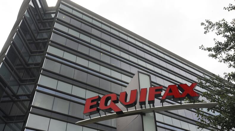 FILE - This July 21, 2012, file photo shows Equifax Inc., offices in Atlanta. On Monday, Sept. 11, 2017, Equifax said it has made changes to address customer complaints since it disclosed a week earlier that it exposed vital data on about 143 million Americans. Equifax has come under fire from members of Congress, state attorneys general, and people who are getting conflicting answers about whether their information was stolen. Equifax is trying again to clarify language about people’s right to sue, and said Monday it has made changes to address customer complaints. (AP Photo/Mike Stewart, File)