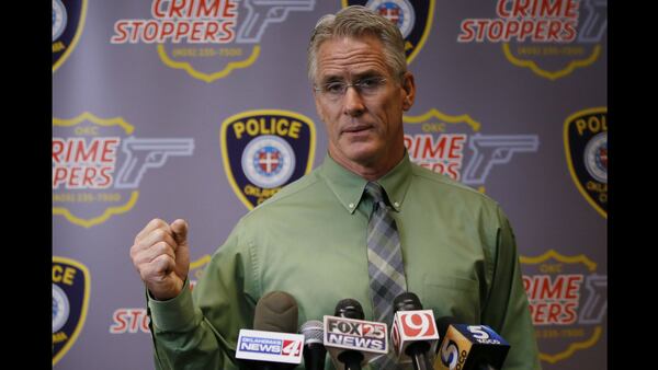 Oklahoma City Police Capt. Bo Mathews demonstrates how Magdiel Sanchez reportedly held a metal pipe before he was shot and killed by a police officer Tuesday, Sept. 19, 2017. Mathews said that the Oklahoma City police officer who opened fire on Sanchez may not have heard witnesses screaming that the deaf man could not hear officers telling him to drop the pipe.