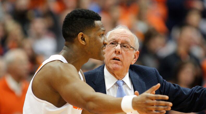 Syracuse head coach Jim Boeheim, right, talks with Syracuse Andrew White III, left, in the second half of an NCAA college basketball game against Georgia Tech in Syracuse, N.Y., Saturday, March 4, 2017. Syracuse won 90-61. (AP Photo/Nick Lisi)
