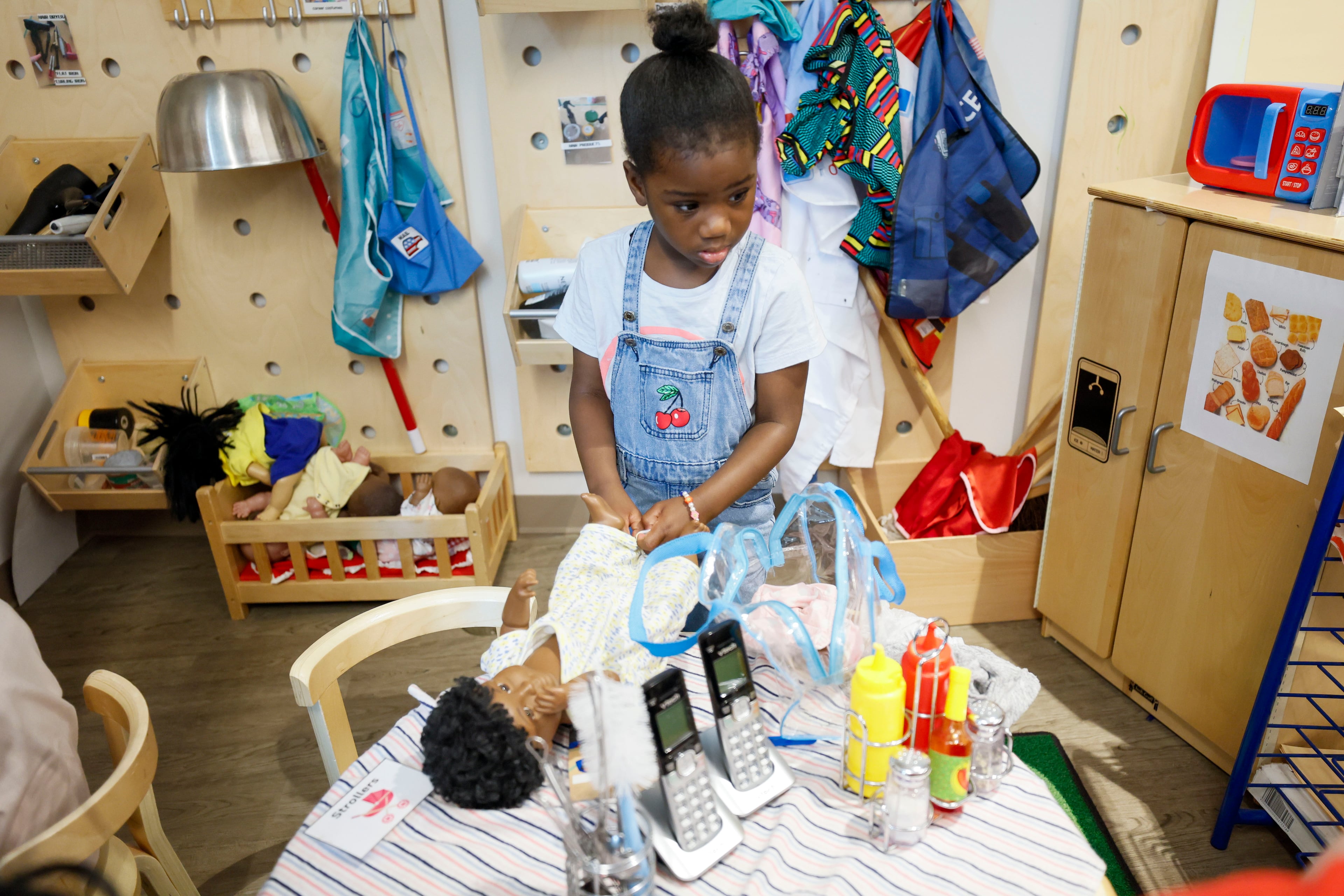 A child in the Head Start program engages in indoor activities at the Arthur M. Blank Early Learning Center, Monday. (Miguel Martinez/AJC)