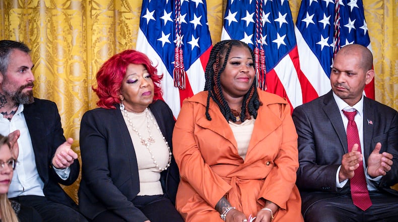 The election workers from Georgia, Ruby Freeman and her daughter, Shaye Moss, acknowledged by President Joe Biden during an event commemorating the second anniversary of the attack on the U.S. Capitol, in the East Room of the White House in Washington on Jan. 6, 2023. (Pete Marovich/The New York Times)