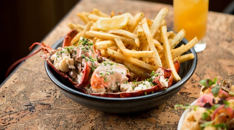 Bully Boy Maine Lobster Frites, a 1 3/4 lb lobster with truffle cream and shoe string fries, on the half shell. Photo credit- Mia Yakel