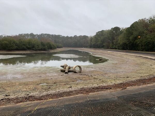 The pond at Joseph Tribble Park was drained earlier this year after multiple breaches were discovered.