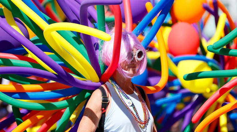 An attendee enjoys the annual Pride Parade in Atlanta on Sunday, Oct. 13, 2024. (Miguel Martinez/AJC)