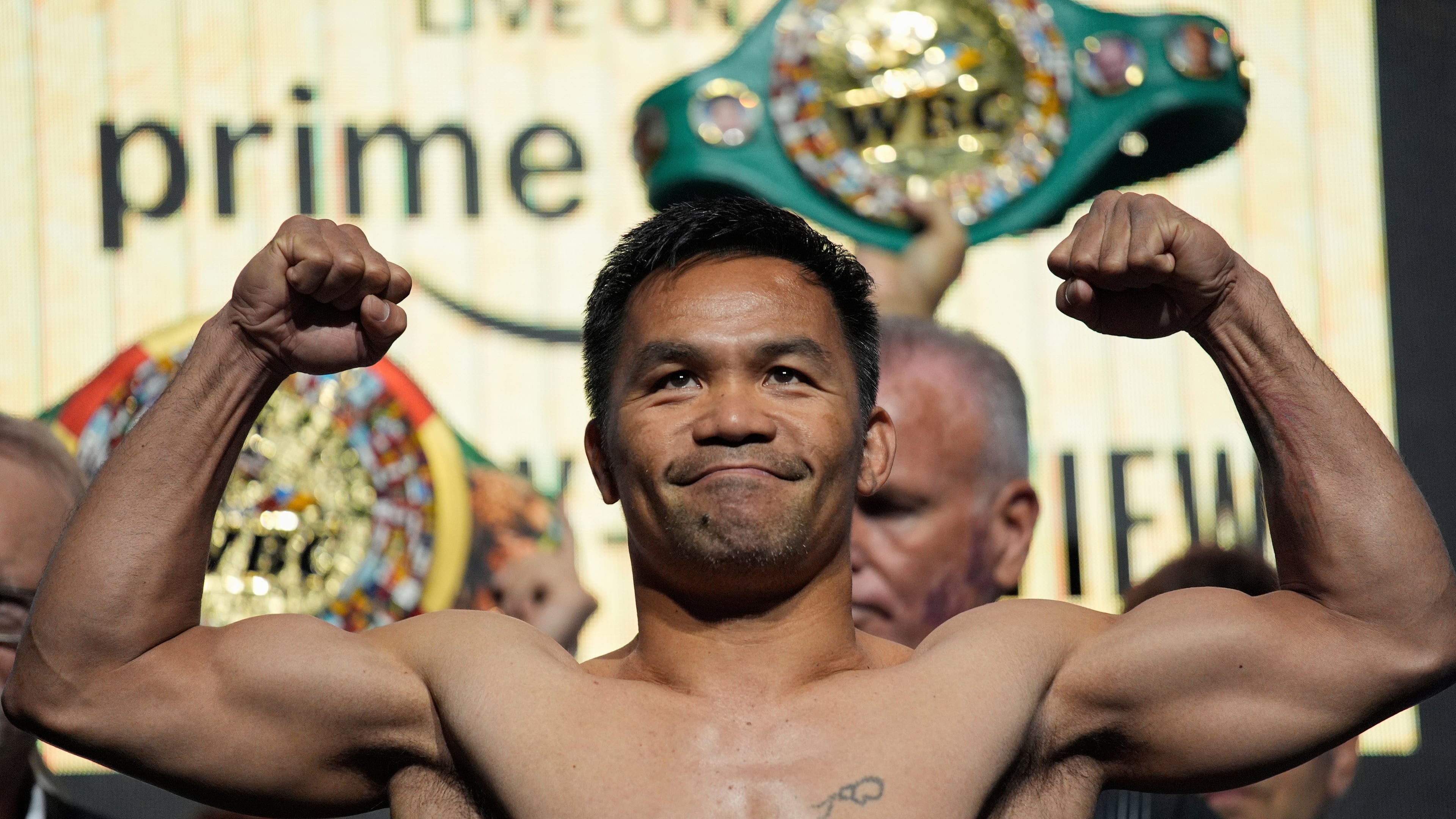 FILE - Manny Pacquiao poses on the scale during a ceremonial weigh in Friday, July 18, 2025, in Las Vegas. (AP Photo/John Locher, file)