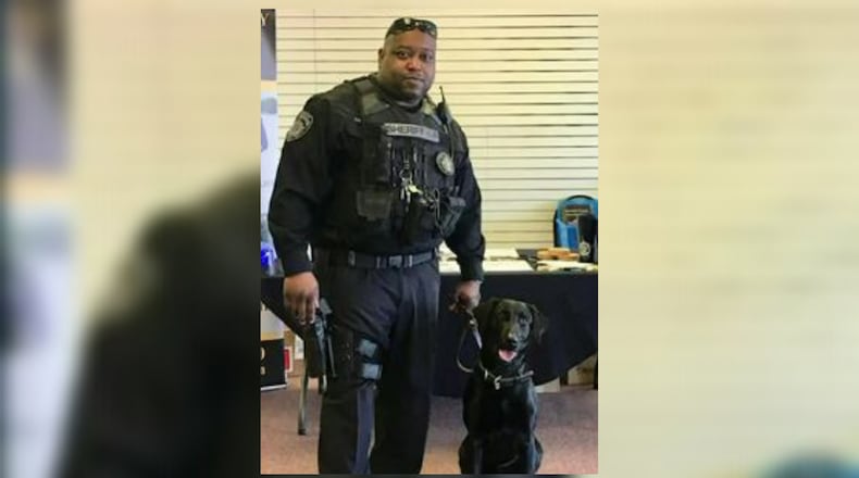 Rockdale County Deputy Eric Tolbert was removed from the K-9 unit in August after an animal cruelty investigation, the sheriff's office said.