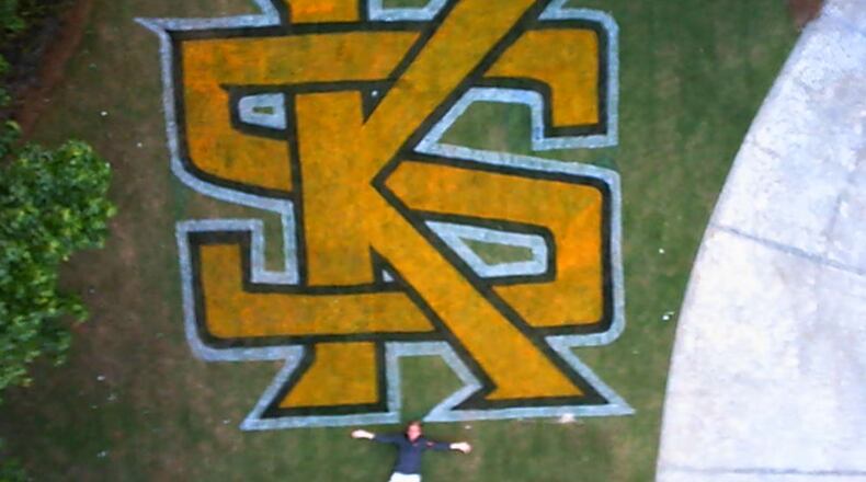 Tom Lindsey painted a Kennesaw State logo in the front lawn of their home in Powder Springs as a graduation gift for his son, Joseph (pictured). They shot this photo using a camera mounted on a drone.