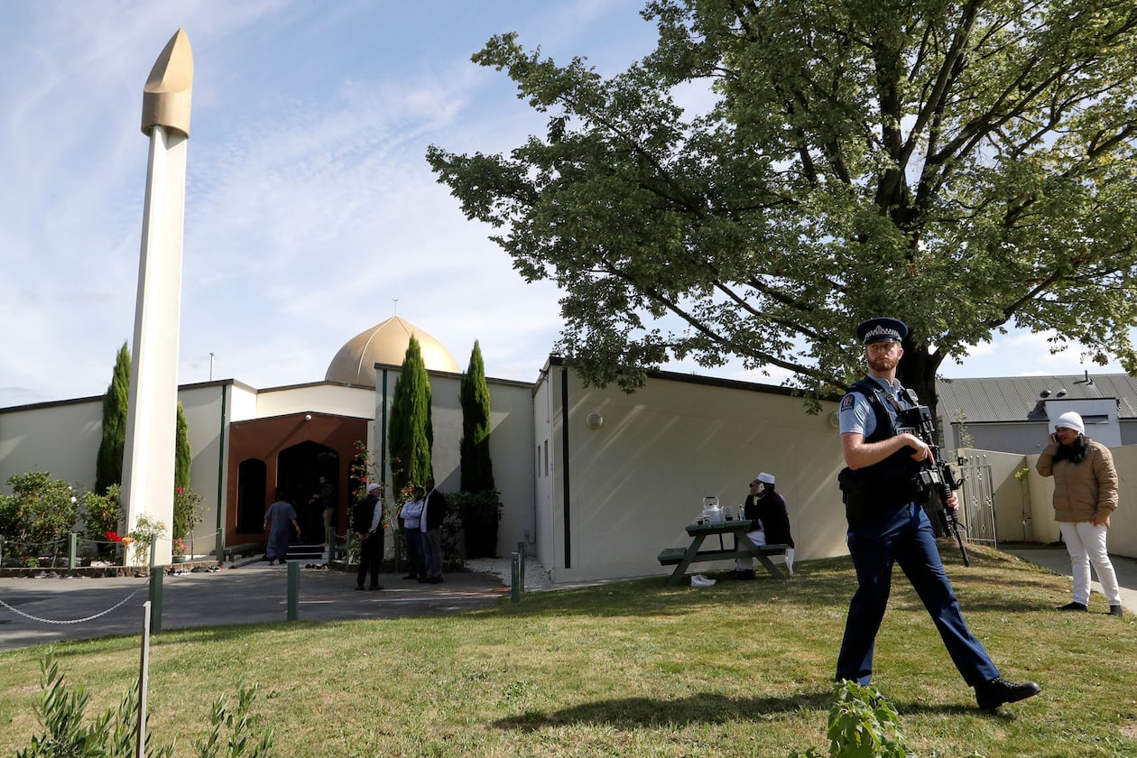 FILE - An armed policeman patrols the grounds at the Al Noor mosque following the previous week's mass shooting in Christchurch, New Zealand, on March 23, 2019. (AP Photo/Mark Baker, File)