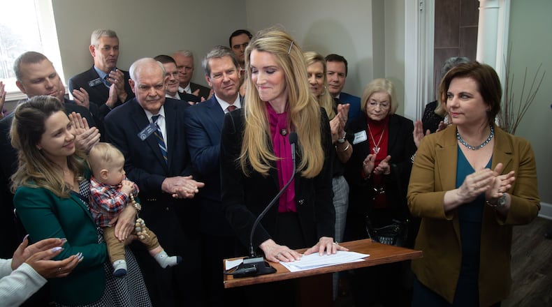 U.S. Senator Kelly Loeffler joined by Gov. Brian Kemp and Susan B. Anthony List President Marjorie Dannenfelser (R) speaks during a press conference at the First Care Women's Clinic in Marietta Friday, February 14, 2020.   (Steve Schaefer for The Atlanta Journal-Constitution)