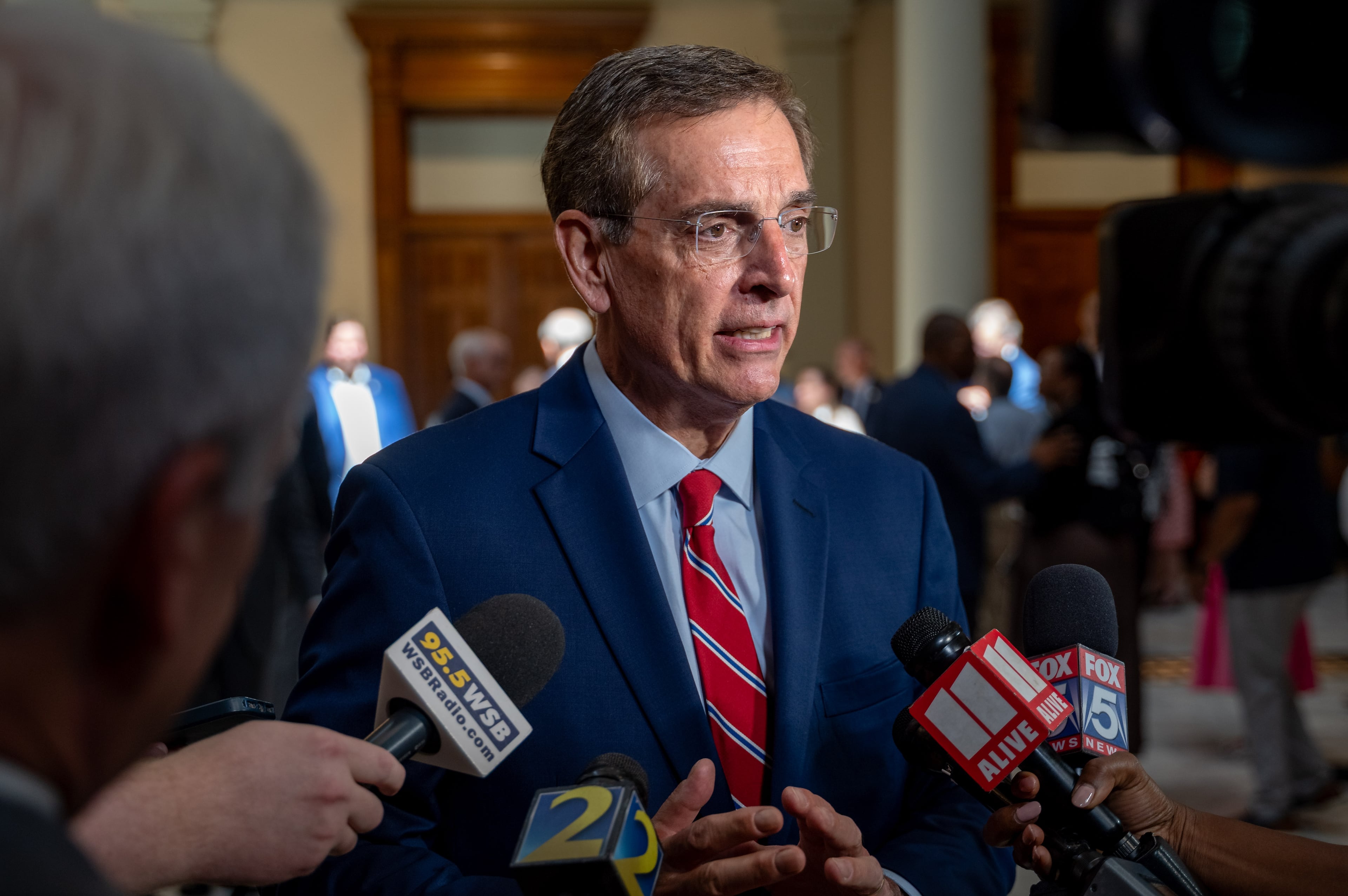 Georgia state lawmakers gather in the south atrium to pray for the victims of the Guadalupe River flooding in Texas.