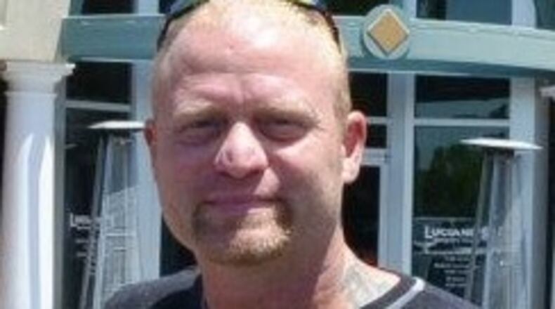 Brian Whitfield, 45, died from multiple gunshots Saturday in what police believe was a robbery at his Gwinnett County home.