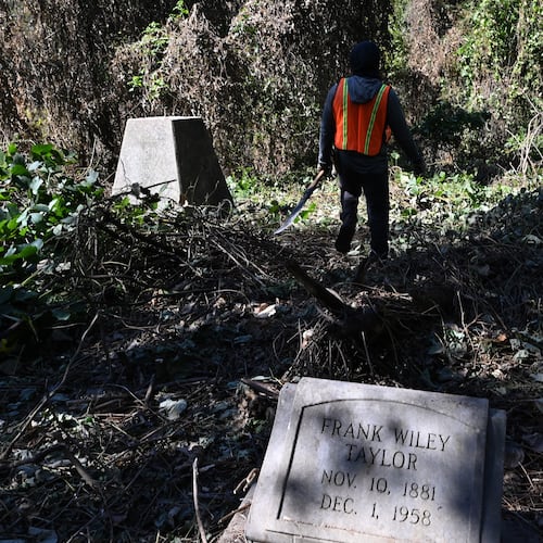 Yusuf Shabazz with Devine GA, clears up decades of kudzu and ivy choking the site of Hollywood Cemetery, 70 acres of abandoned grounds that had been left in neglect for decades, Friday, Oct. 24, 2025, in Atlanta. (Hyosub Shin / AJC)