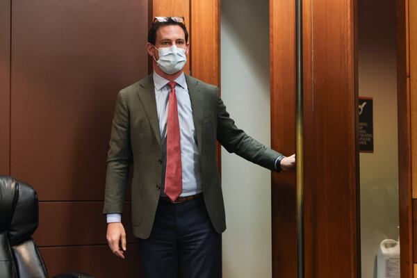 John Fowler, lead prosecutor with the Attorney General’s office walks into the courtroom after bringing in a witness during a motions hearing in the RICO case against protesters of the Atlanta Public Safety Training Center at Fulton County Courthouse on Wednesday, July 31, 2024. (Natrice Miller/ AJC)
