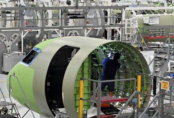 A worker works at Gulfstream’s manufacturing facility at Gulfstream Aerospace Corporation in December. (Hyosub Shin/AJC)