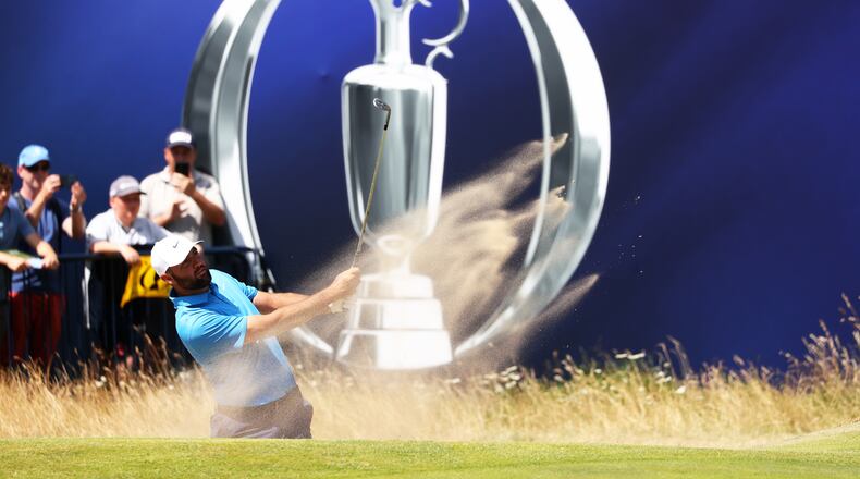 US golfer Scottie Scheffler plays out of the bunker during a practice round at the British Open Golf Championship at Royal Birkdale, Southport, England, Monday, July 13, 2026. (AP Photo/Peter Morrison)