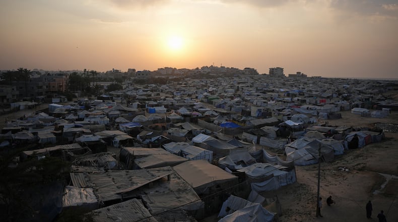 A tent camp for displaced Palestinians stretches along Zawaida in the central Gaza Strip on Tuesday, Nov. 4, 2025. (AP Photo/Abdel Kareem Hana)