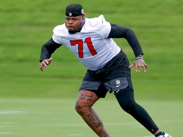 Falcons offensive tackle Jawaan Taylor, shown at practice this summer, missed all of OTAs, mandatory minicamp and the first nine practices of training camp because of knee surgery in March. (Erik S. Lesser for the AJC)