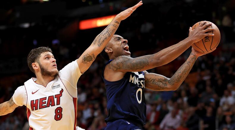 MIAMI, FL - OCTOBER 30: Jeff Teague #0 of the Minnesota Timberwolves drives on Tyler Johnson #8 of the Miami Heat during a game at American Airlines Arena on October 30, 2017 in Miami, Florida. NOTE TO USER: User expressly acknowledges and agrees that, by downloading and or using this photograph, User is consenting to the terms and conditions of the Getty Images License Agreement. (Photo by Mike Ehrmann/Getty Images)