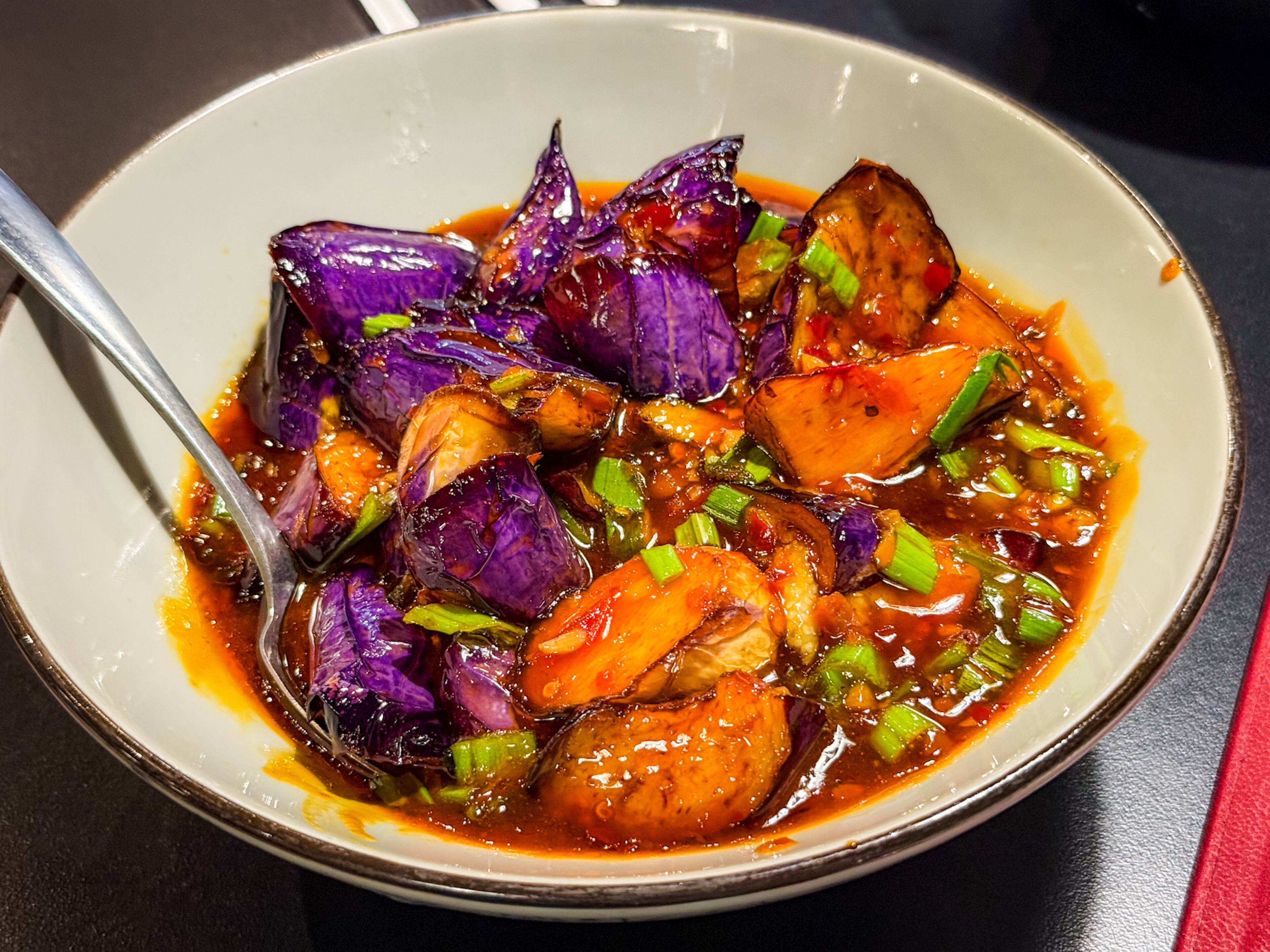 Eggplant in garlic sauce at Chilispot was flavorful even without the restaurant's trademark Sichuan spice. (Henri Hollis/AJC)
