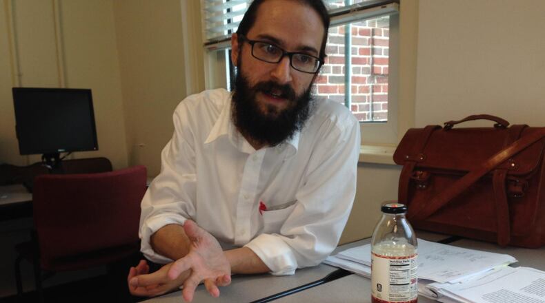 Vincent Gray, a U.S. history teacher at Druid Hills High School, explains how he used a Wal-Mart receipt to hone his students’ critical thinking skills. GRACIE BONDS STAPLES / GSTAPLES@AJC.COM