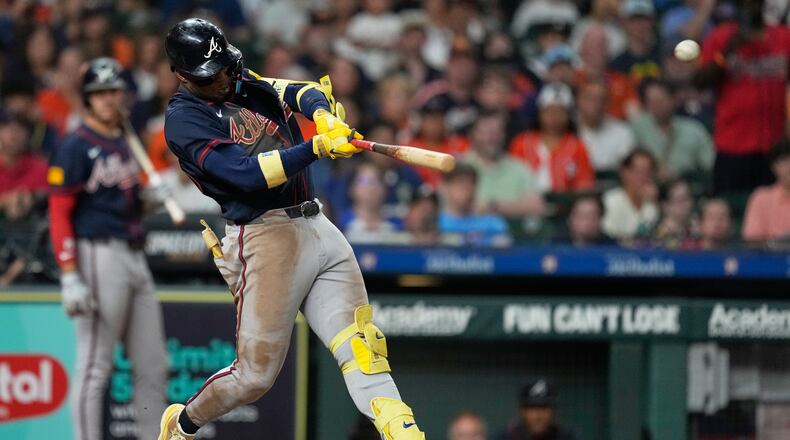 Atlanta Braves' Ronald Acuña Jr. hits a grand slam during the seventh inning of a baseball game against the Houston Astros in Houston, Saturday, Sept. 19, 2026. (AP Photo/Ashley Landis)