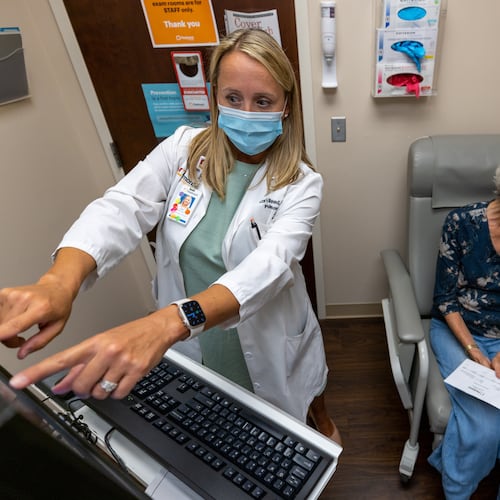 Lead Nurse Practitioner Lori Reed examines a Covid patient at Piedmont Pulmonary Covid Recovery Clinic in Atlanta in 2022. The U.S. Centers for Disease Control and Prevention mostly attributed the nationwide rise in life expectancy to fewer deaths caused by the infectious disease. (Steve Schaefer/AJC file)