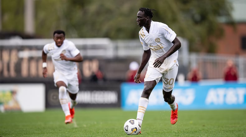 Atlanta United forward Machop Chol (30) dribbles the ball against Birmingham Legion FC during friendly match Sunday, March 28, 2021, at BBVA Field in Birmingham, Ala. (Jacob Gonzalez/Atlanta United)