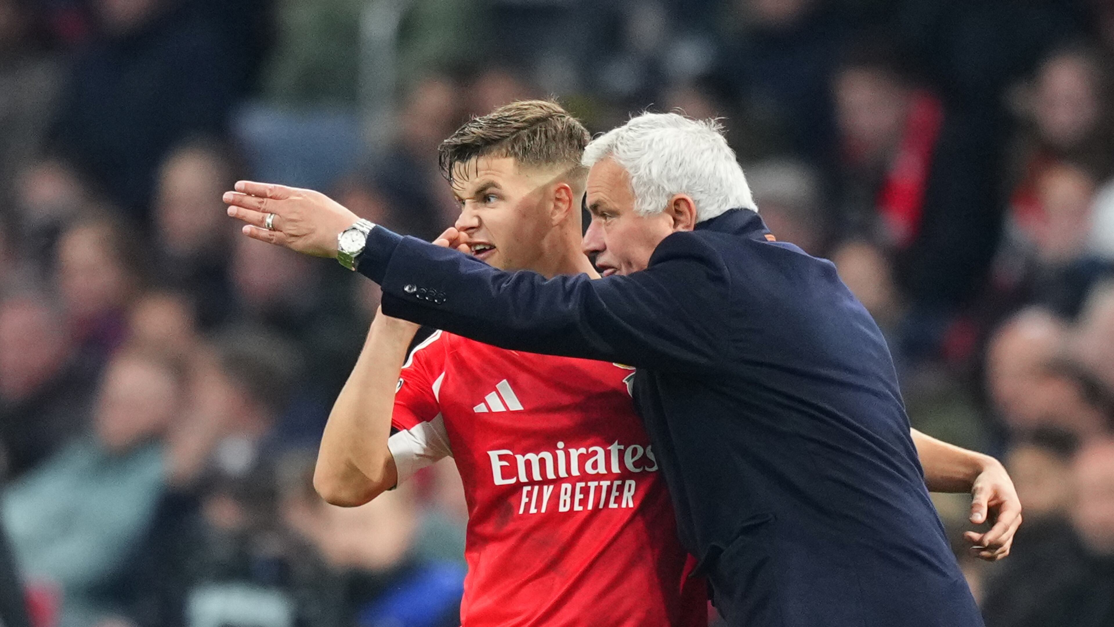 Benfica's head coach Jose Mourinho gives instructions to Benfica's Samuel Dahl during the Champions League opening phase soccer match between Ajax and SL Benfica in Amsterdam, Netherlands, Tuesday, Nov. 25, 2025. (AP Photo/Peter Dejong)