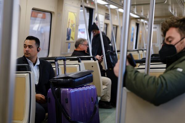 Passengers are seen on a train at the MARTA Airport Station in Atlanta on Tuesday, April 19, 2022.   (Arvin Temkar / arvin.temkar@ajc.com)