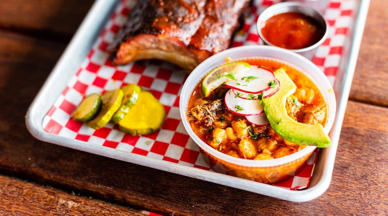 King Barbecue’s Red Pozole (lower right) is a Mexican soup that can serve as a side for a barbecue meal. As shown here, it can be topped with thin slices of radish and avocado. CONTRIBUTED BY HENRI HOLLIS