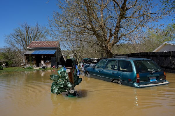 FILE - A home is flooded by the Kentucky River, Lockport, Ky., Tuesday, April 8, 2025. (AP Photo/Carolyn Kaster, File)