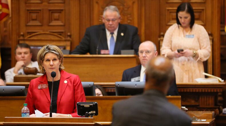 April 2, 2015 - Atlanta - Speaker Pro Tem Jan Jones ,, taking a question from Rep. Calvin Smyre, D - Columbus, presents HB 213, a transportation related bill to allow the counties that fund MARTA to increase the tax that supports it. Democrats were promised passage of the bill in order to secure a vote on the big transportation bill. With the legislative session ending Thursday, GOP leaders OK'd a slew of tax increases, gave the state more control over local public schools and shot down 'religious liberty' efforts -- all while working hand-in-glove with Democrats to beat back fringe Republicans who've otherwise split the majority caucus. BOB ANDRES / BANDRES@AJC.COM