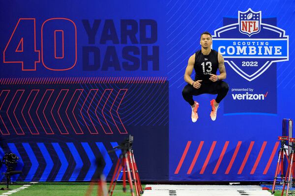 Desmond Ridder #QB13 of  Cincinnati prepares to run the 40 yard dash during the NFL Scouting Combine at Lucas Oil Stadium on March 3, 2022, in Indianapolis, Indiana. (Justin Casterline/Getty Images/TNS)