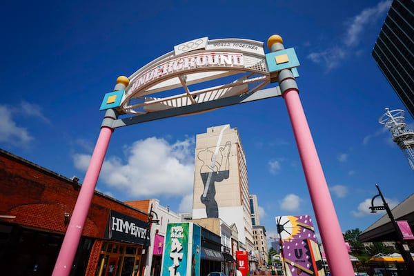 The big mural looming over Underground Atlanta has confused passersby since it was painted on the side of a building in 2011. (Miguel Martinez/ AJC)