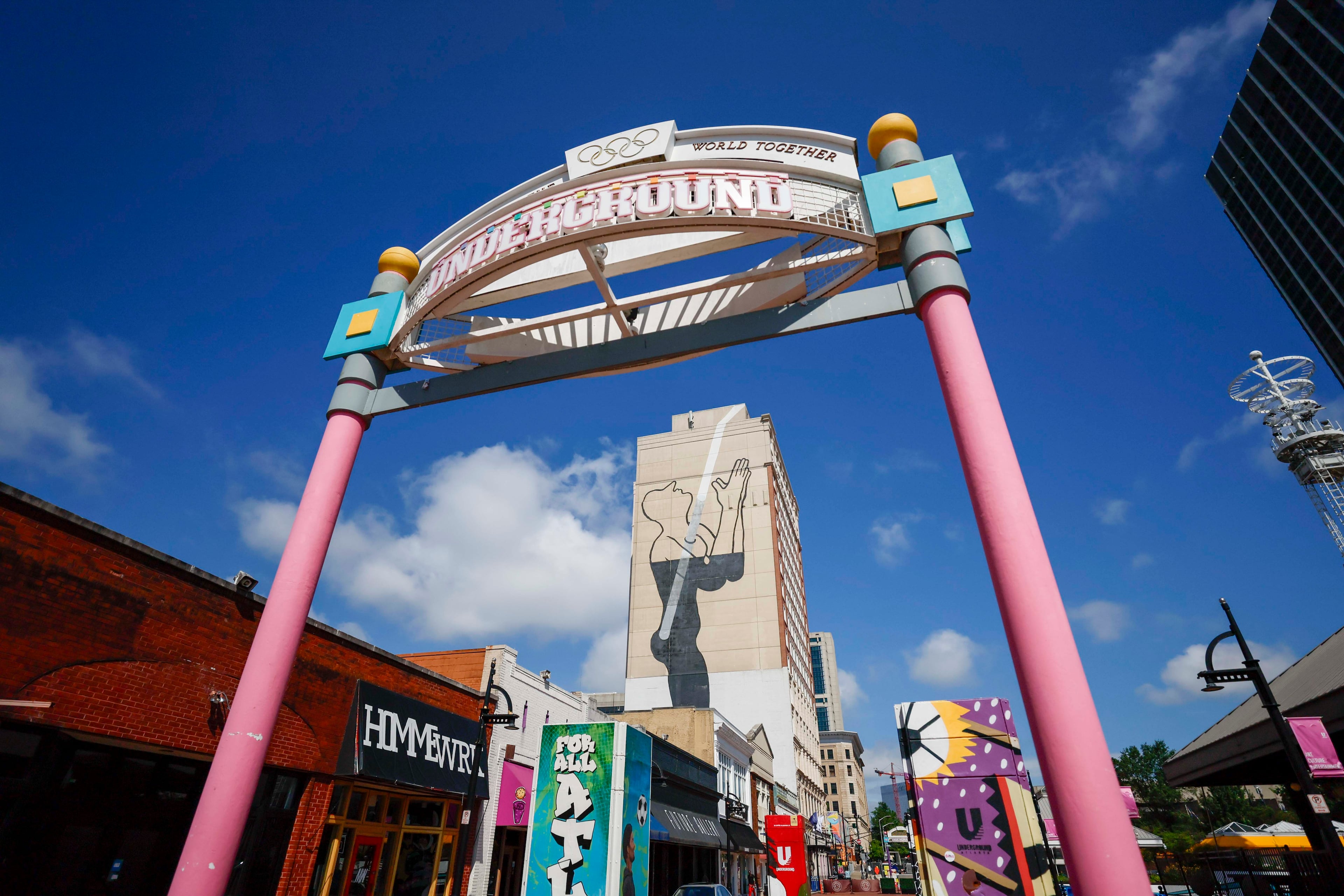 The big mural looming over Underground Atlanta has confused passersby since it was painted on the side of a building in 2011. (Miguel Martinez/ AJC)