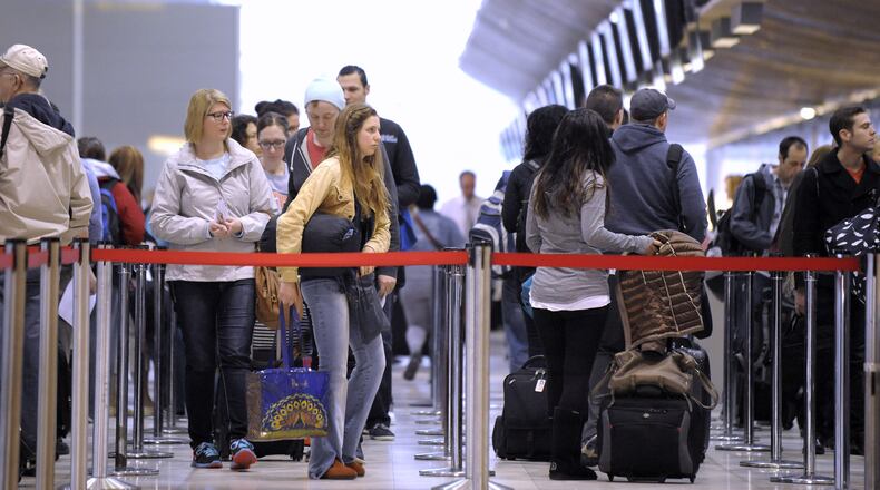 In an April 14, 2016 photo, assengers stand in the security line at Metro Airport in Romulas, Mich. Metro officials say passenger traffic is up more than a million passengers in 2015 after years of staying stagnant for five years at 32 million annually and has increased by eight percent the first two months of this year. Travel agencies also say that they also saw an uptick in travel last year. Airline officials say increased competition with Delta on flights and more non-stop services are the reason. Others say the economy. (Todd McInturf/ The Detroit News via AP)