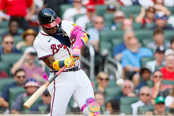 Atlanta Braves' Ronald Acuña Jr. (13) connects the ball for a double during the fifth inning of a baseball game against the San Diego Padres on Sunday, May 25, 2025, in Atlanta. (Miguel Martinez/Atlanta Journal-Constitution via AP)