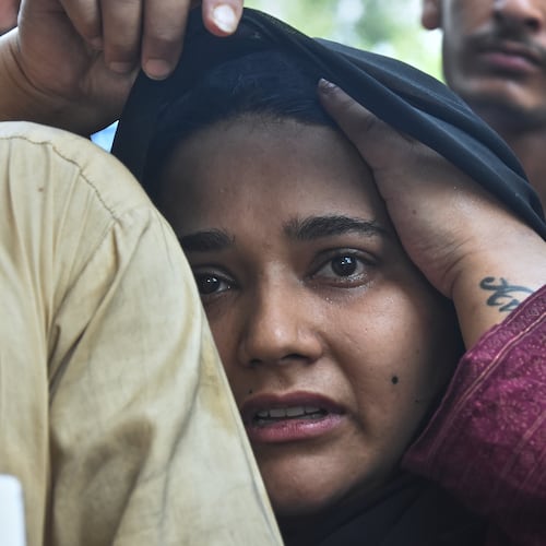 A woman, who lost her baby in a hospital fire, reacts at a hospital in Islamabad, Pakistan, Wednesday, Aug. 26, 2026. (AP Photo)