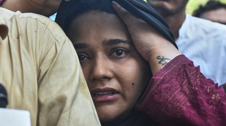 A woman, who lost her baby in a hospital fire, reacts at a hospital in Islamabad, Pakistan, Wednesday, Aug. 26, 2026. (AP Photo)