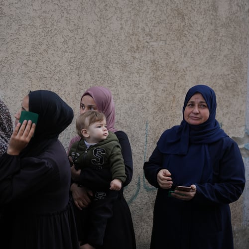 Palestinian women line up in front of a polling station to vote for local elections, the first in two decades in Gaza and the first in the occupied West Bank since the start of the Israel-Hamas war in Deir al-Balah, central Gaza Strip, Saturday, April 25, 2026. (AP Photo/Abdel Kareem Hana)