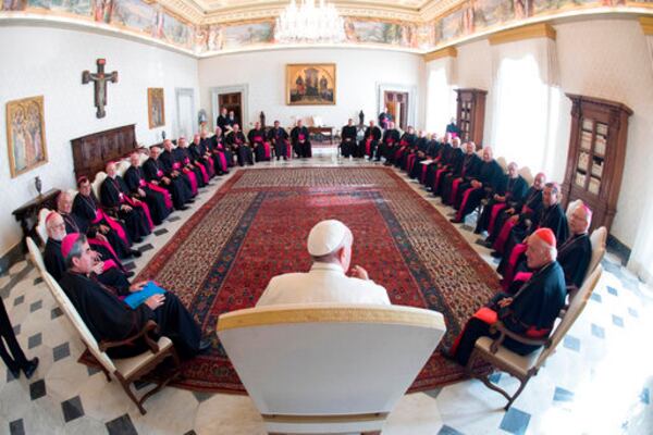FILE - In this Feb. 20, 2017 file photo, Pope Francis meets with the Chilean Bishops Conference, at the Vatican. (L'Osservatore Romano/Pool Photo via AP, file)