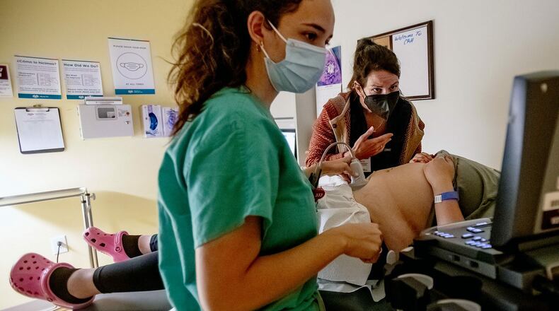 A family physician and her resident perform an ultrasound on a 25-year-old woman the day before the Supreme Court overturned Roe v. Wade at the Center for Reproductive Health clinic in Albuquerque, New Mexico. New Mexico will see an influx of patients from neighboring states which have banned abortion. (GINA FERAZZI/LOS ANGELES TIMES/GETTY IMAGES)