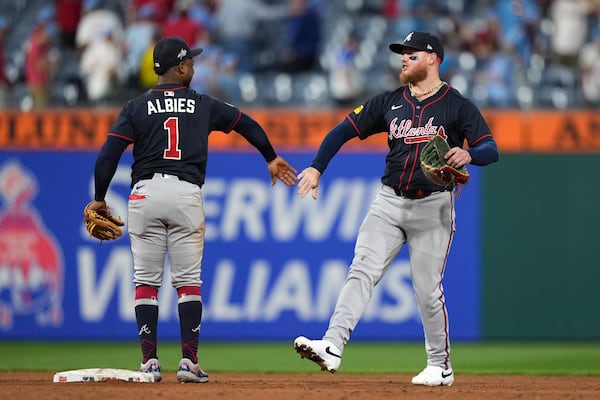 Atlanta Braves' Alex Verdugo, right, and Ozzie Albies celebrate after the Braves won the second baseball game of a doubleheader against the Philadelphia Phillies Thursday, May 29, 2025, in Philadelphia. (AP Photo/Matt Slocum)